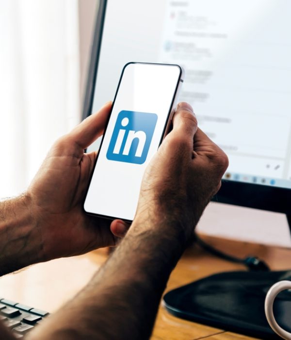 Linkedin,App,On,Smartphone,Screen.,Man,Holding,A,Phone,With